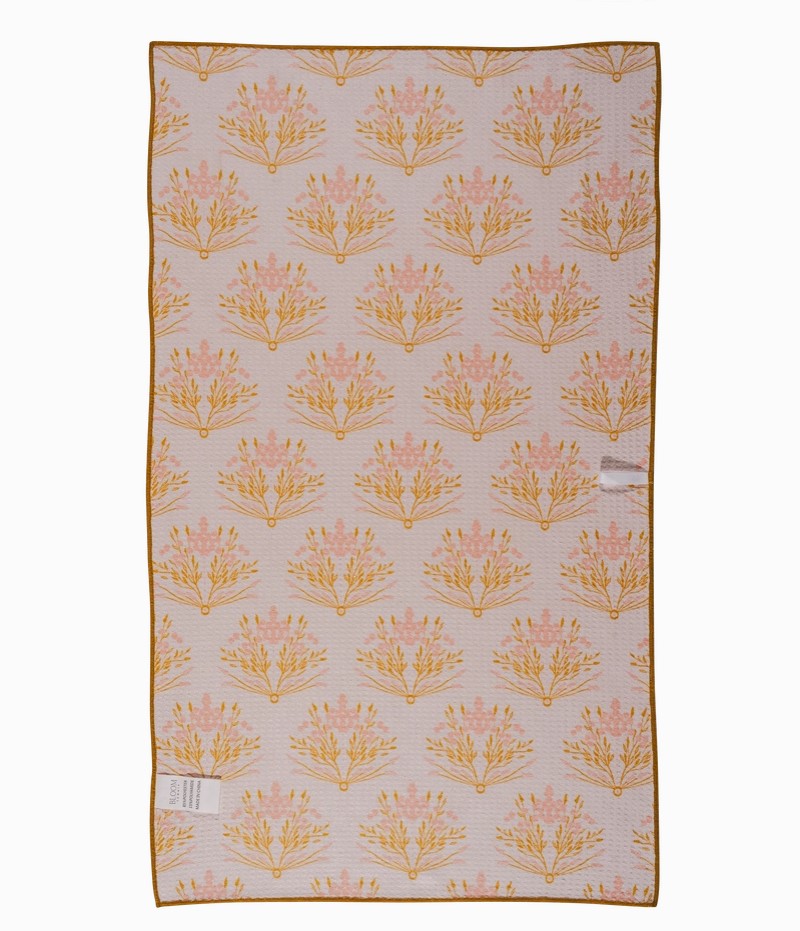 Golden floral tea towel on farmhouse kitchen counter