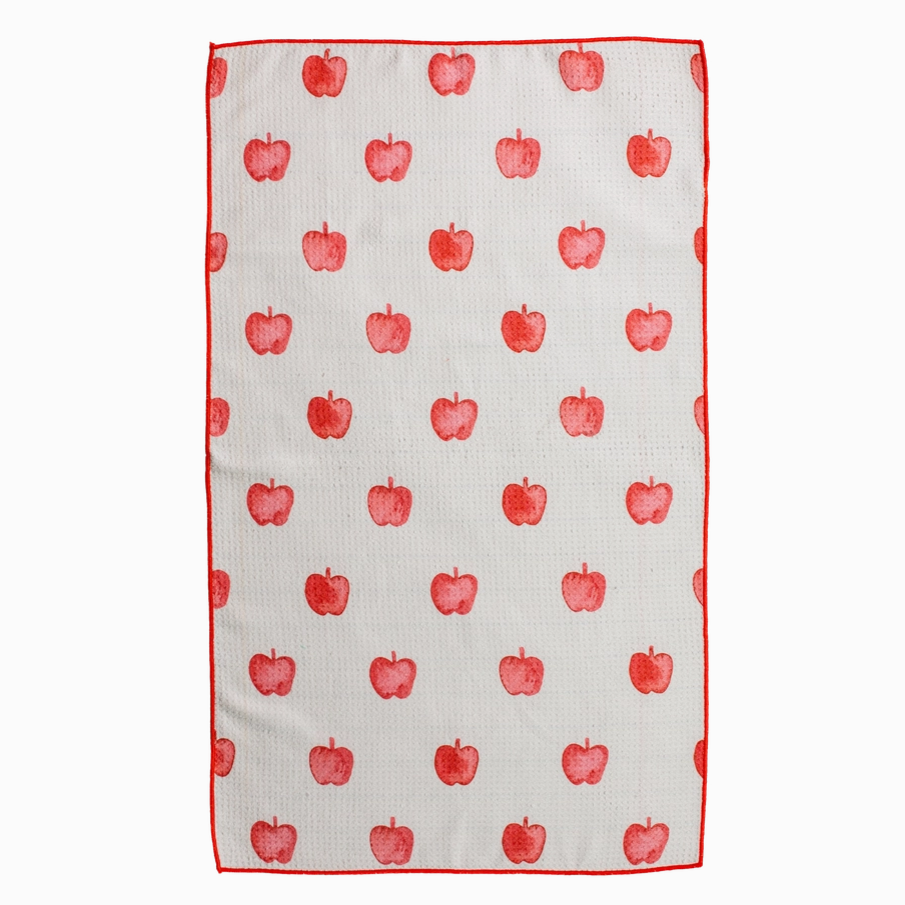 Kitchen towel with red apple pattern on a white background