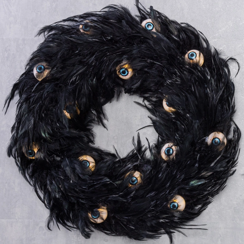 haunted house wreath featuring spooky eyes