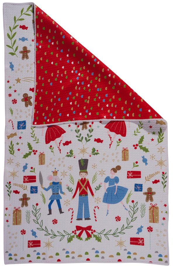 Kitchen towel with Christmas Nutcracker theme design featuring characters and decorations on a white background