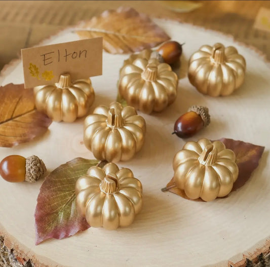 pumpkin place card holders on table