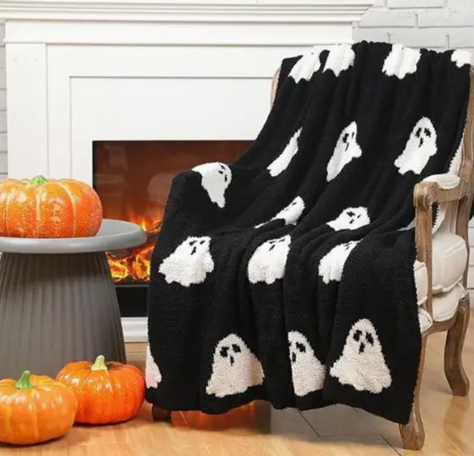 Ghosts throw blanket draped over a couch
