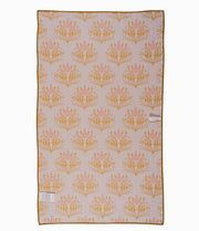 Golden floral tea towel on farmhouse kitchen counter