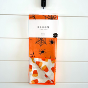 autumn kitchen towel with bright candy corn graphic