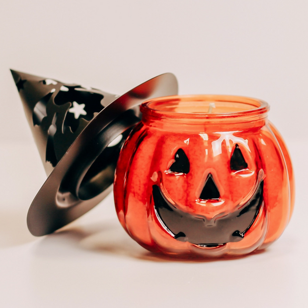 Warm glowing jack-o'-lantern candle for seasonal decor