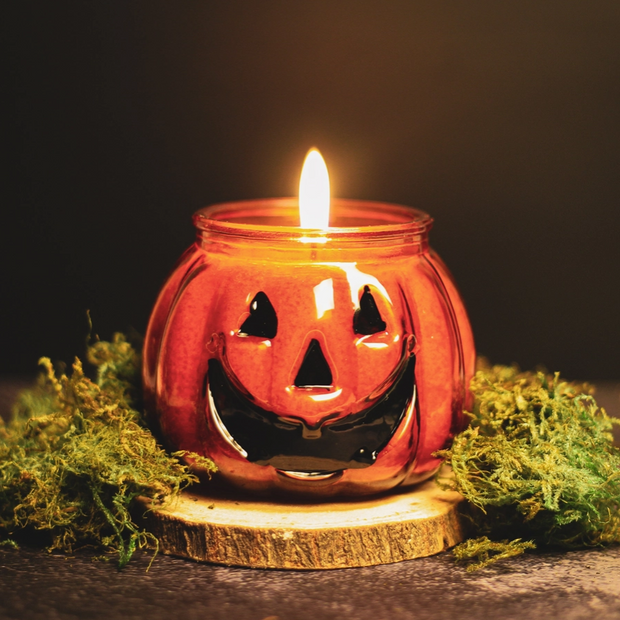 Festive autumn candle featuring classic jack-o'-lantern look