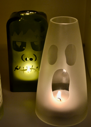 Clear glass candle cover on a pillar candle