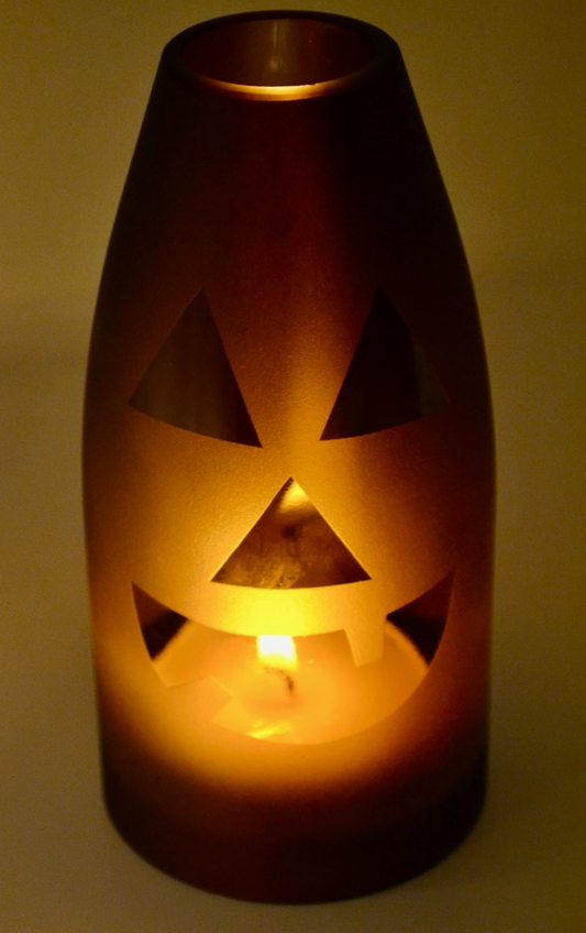 Clear glass candle cover on a pillar candle