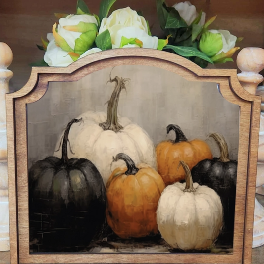 Decorative picture frame featuring festive pumpkin designs