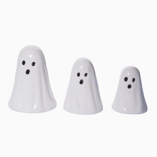 Three white ghost-shaped objects on a white background