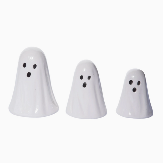 Three white ghost-shaped objects on a white background