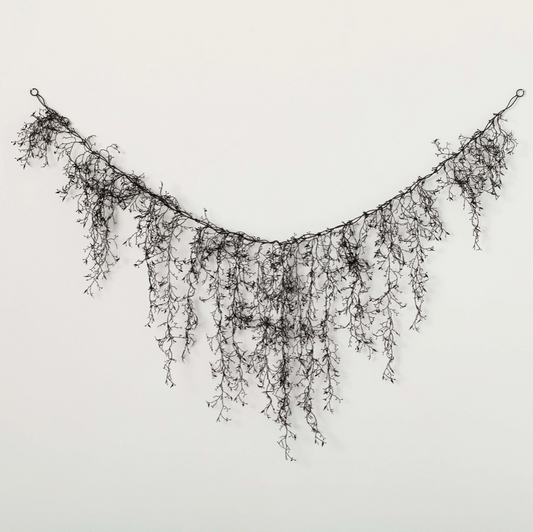 Halloween black swag garland on staircase