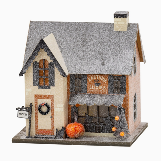 Vintage-style haunted house Halloween art print with Eastside Elixirs label