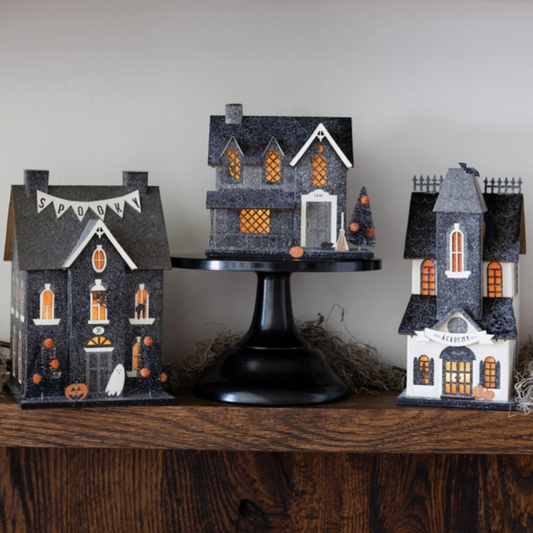 Vintage-style haunted house artwork for Halloween decor
