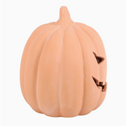 Pumpkin-shaped night light with a triangular face on a white background