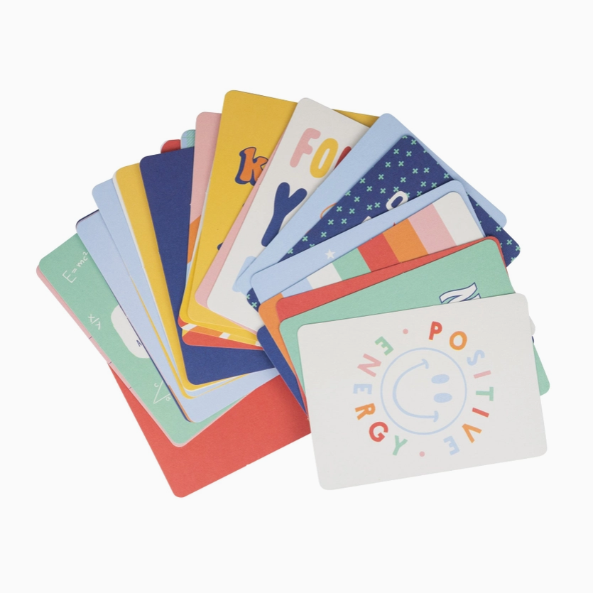 Set of colorful flashcards with various words and designs on a white background