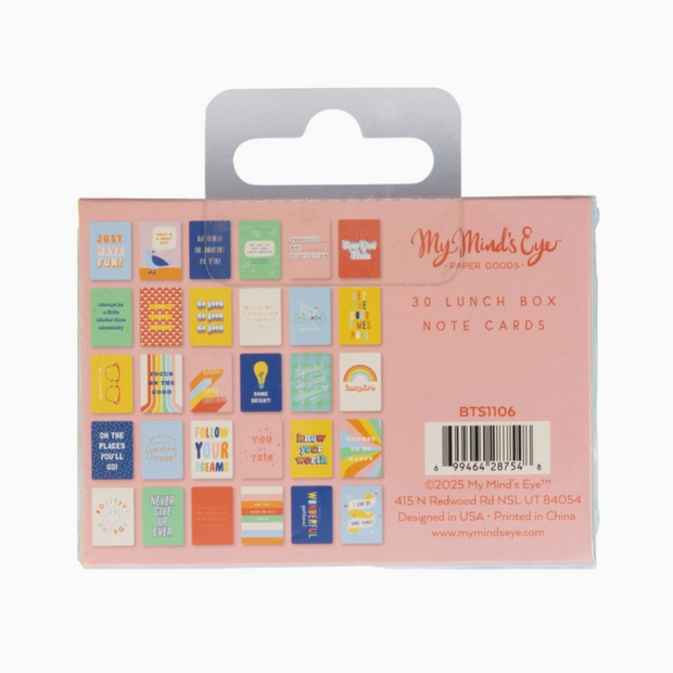 Packaging of 3D lunch box note cards with colorful designs on a pink background.