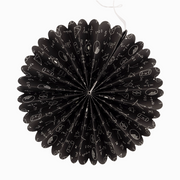 Black paper fan with white designs on a white background