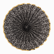 Black and white patterned umbrella with wooden handle on a white background