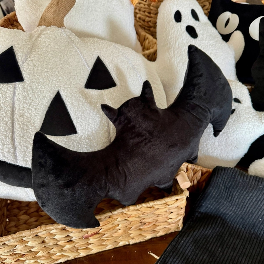 Halloween bat throw pillow on couch