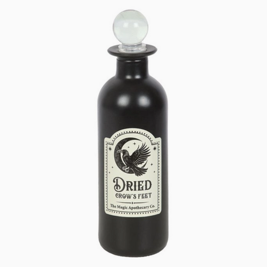 Apothecary-style bottle with spooky label and vintage design