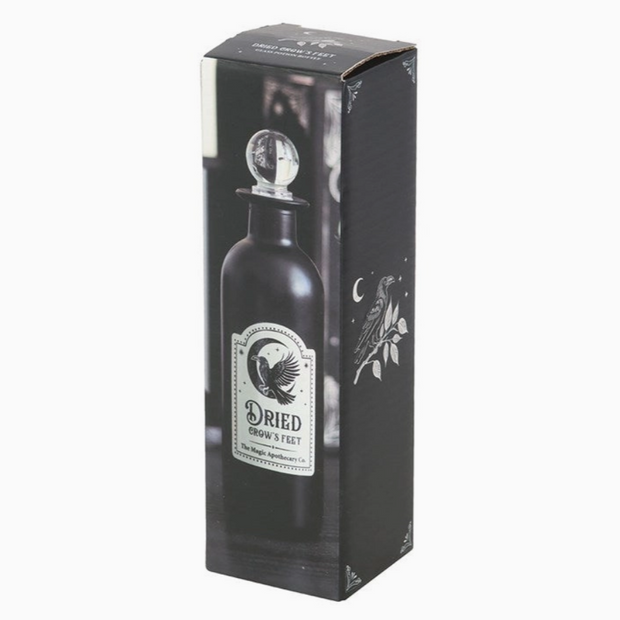 Glass Halloween bottle with eerie witchcraft theme