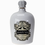 Poison bottle labeled Raven’s Cure with gothic style