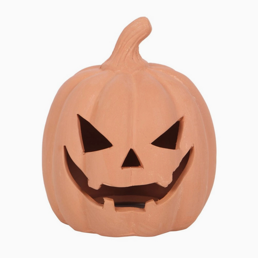 Pumpkin-shaped jack-o'-lantern with a carved face on a white background