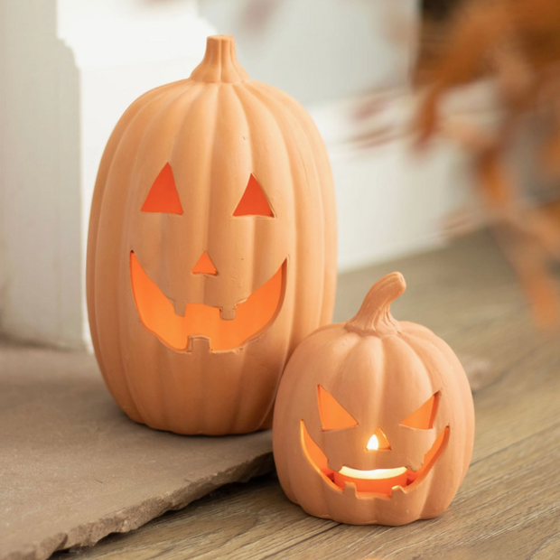 Handcrafted terracotta pumpkin with spooky charm