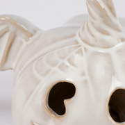 Close-up of spooky bat wings and pumpkin face