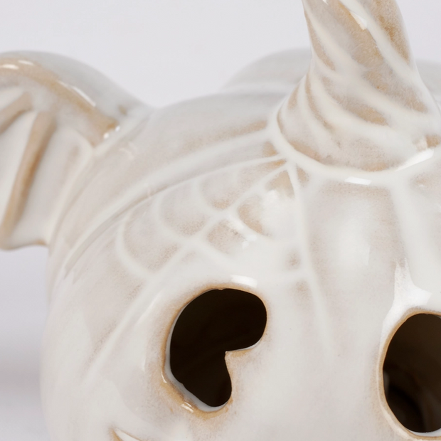Close-up of spooky bat wings and pumpkin face