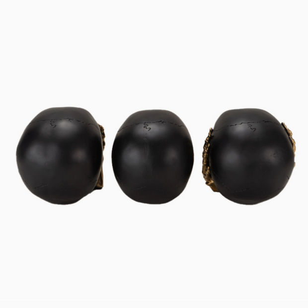Trio of spooky skull decorations