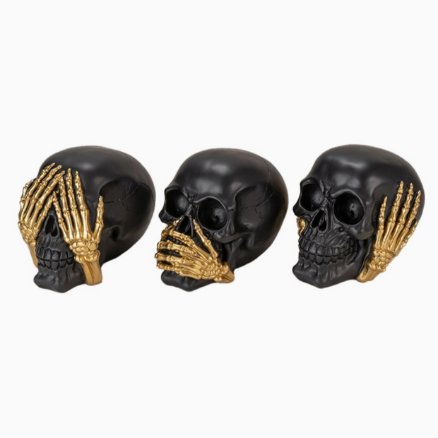 Artistic skull figurines in No Evil design