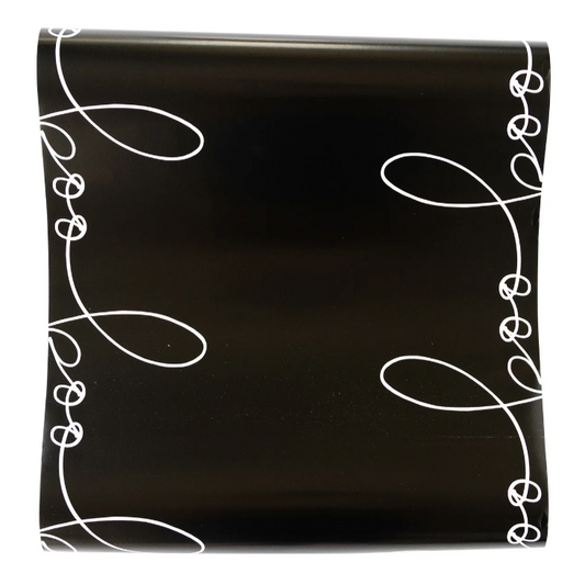 Halloween table runner with bold “BOO” lettering