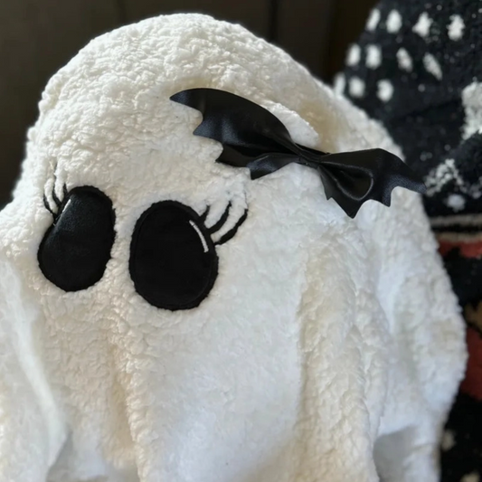 Ghost Gal throw pillow on a Halloween-themed sofa