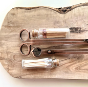 Stylish wick trimmer and match set for candle maintenance