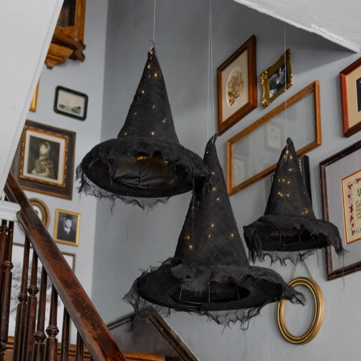Illuminated witch hat artwork glowing with magical light