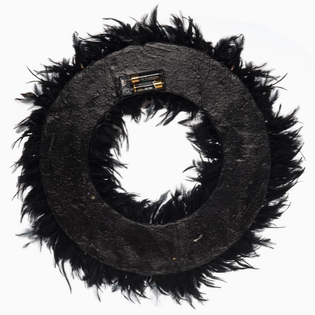 creepy eye wreath hanging on front door
