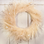 Pampas grass wreath on a wooden surface