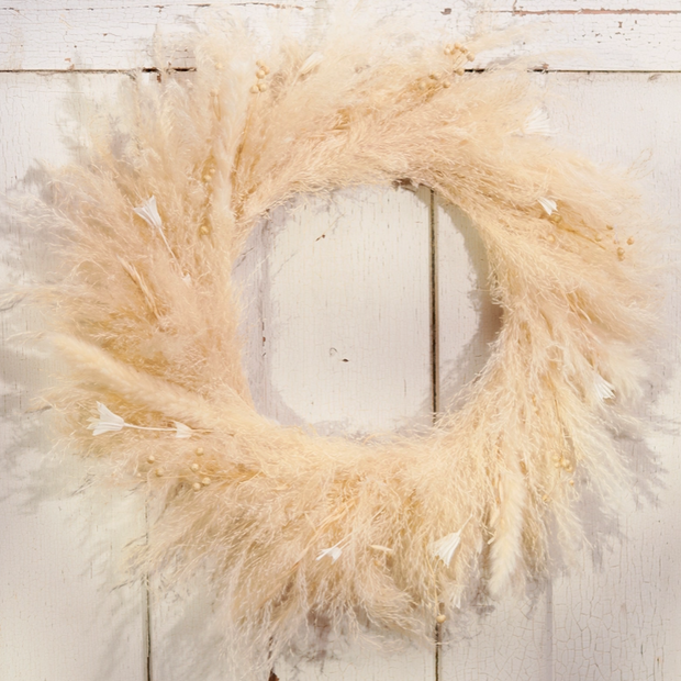 Pampas grass wreath on a wooden surface